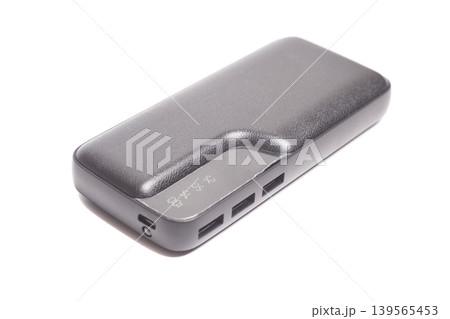 portable external battery for charging phone isolated on white background portable external battery for charging phone isolated on white background 139565453