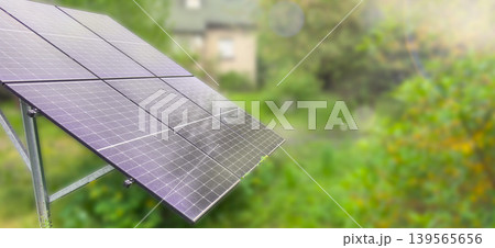 Solar panels in green garden environment, photovoltaic renewable energy system with sunlight and copy space, sustainable electricity and eco technology. Solar panels in green garden environment, photovoltaic renewable energy system with sunlight and copy space, sustainable electricity and eco technology. 139565656