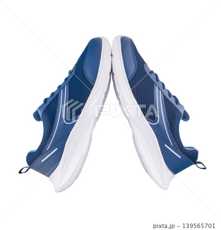 two sneakers of blue color pressed to each other on white background two sneakers of blue color pressed to each other on white background 139565701