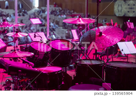 Drum kit on stage before a concert behind a screen 139565904