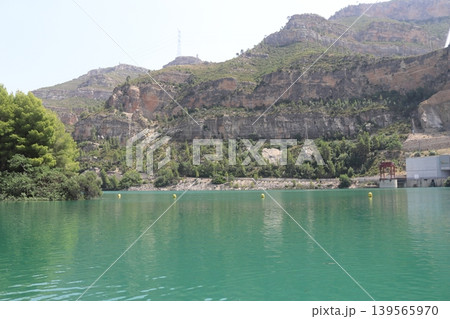 Hydroelectric power plant and dam infrastructure at Cortes de Pallas reservoir, Spain. Hydroelectric power plant and dam infrastructure at Cortes de Pallas reservoir, Spain. 139565970