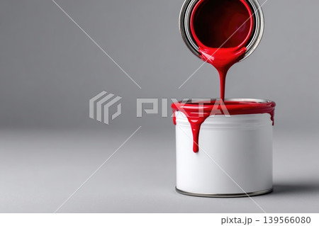 Creative concept art showcasing a pouring red paint can into another container Creative concept art showcasing a pouring red paint can into another container 139566080