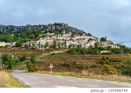 Cluster of houses forming the medieval village of Trigance with its castle on a rocky cliff in Provence, France Cluster of houses forming the medieval village of Trigance with its castle on a rocky cliff in Provence, France 139566744