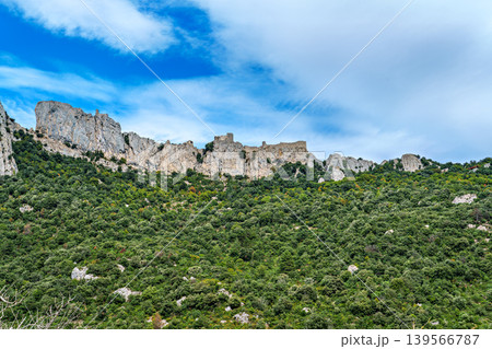 The Cathar medieval castle of Peyrepertuse in the Aude department, southern France situated in the French Pyrenees The Cathar medieval castle of Peyrepertuse in the Aude department, southern France situated in the French Pyrenees 139566787