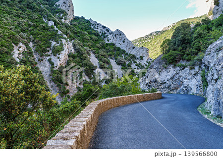 Driving through the amazing Gorges de Galamus, Aude, Eastern Pyrenees, Languedoc Roussillon, France. 139566800