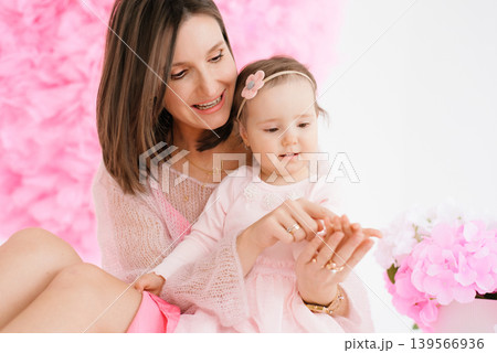 Mother and Toddler Daughter Playing with Hands Together 139566936