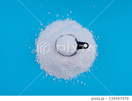 Detergent powder pile. Laundry washing soap granules, small white texture of oxygen bleach 139567470