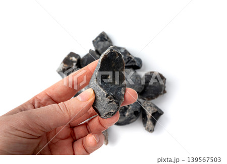 Natural black flint, chert mineral isolated 139567503