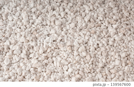Perlite textured background, crushed amorphous volcanic glass close up 139567600