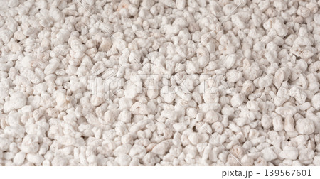 Perlite textured background, crushed amorphous volcanic glass close up Perlite textured background, crushed amorphous volcanic glass close up 139567601