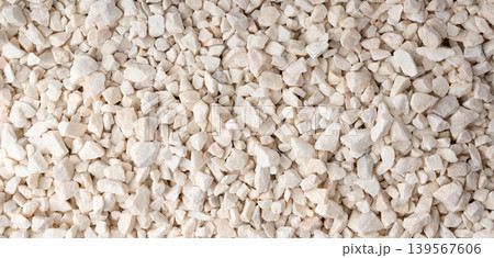 Crushed quartzite pebble textured background, white decorative marble stones close up Crushed quartzite pebble textured background, white decorative marble stones close up 139567606