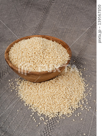 Sesame seeds pile closeup, white small benne grains. Sesamum indicum fruits 139567850