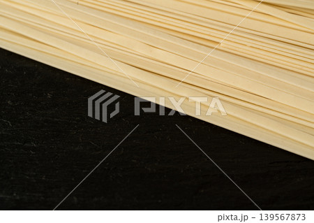 Wheat soba closeup, raw udon noodles Wheat soba closeup, raw udon noodles 139567873