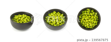 Edamame beans isolated. Green soy bean pile, cooked young soybean, boiled Japanese pea Edamame beans isolated. Green soy bean pile, cooked young soybean, boiled Japanese pea 139567875
