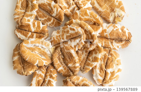 Spelt flakes texture background, dry raw rolled flat oat grains pattern 139567889