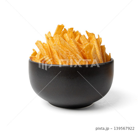 Fried chips sticks isolated, finger potato chips, golden shoestring fries pile, French fries Fried chips sticks isolated, finger potato chips, golden shoestring fries pile, French fries 139567922