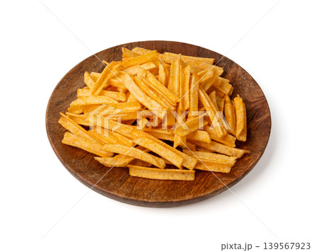 Fried chips sticks isolated, finger potato chips, golden shoestring fries pile, French fries 139567923