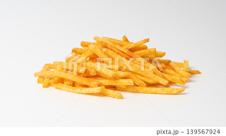 Fried chips sticks isolated, finger potato chips, golden shoestring fries pile, French fries Fried chips sticks isolated, finger potato chips, golden shoestring fries pile, French fries 139567924
