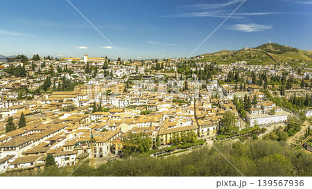 Panoramic View of Historic Granada Neighborhood on Sunlit Hillside in Andalusia Panoramic View of Historic Granada Neighborhood on Sunlit Hillside in Andalusia 139567936