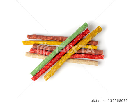 Rawhide chew sticks for dogs, colorful collagen dog food, pressed dry kibble, dental care treats Rawhide chew sticks for dogs, colorful collagen dog food, pressed dry kibble, dental care treats 139568072