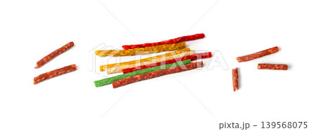 Rawhide chew sticks for dogs, colorful collagen dog food, pressed dry kibble, dental care treats 139568075
