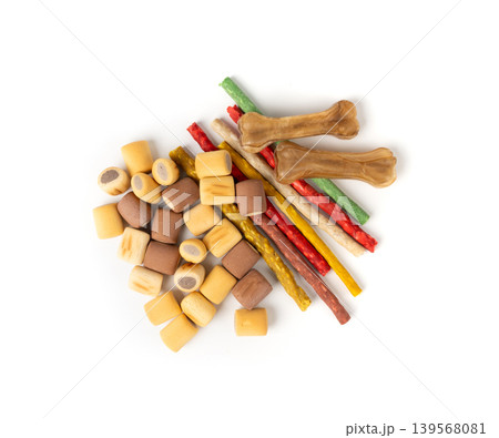 Assorted dog kibble, many canine food, different color dry pet food mix, various dog snack pile 139568081