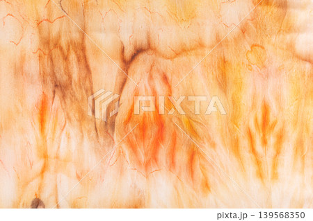 abstract pattern on silk fabric texture in yellow and brown tones 139568350