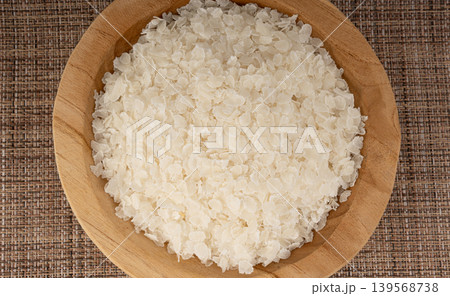 Raw flattened rice. Dry rice flakes or poha, Indian breakfast food Raw flattened rice. Dry rice flakes or poha, Indian breakfast food 139568738