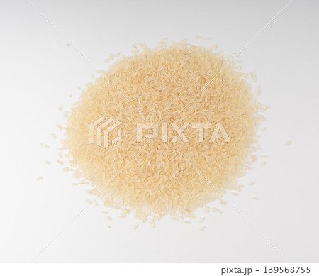 White parboiled rice grains. Dry uncooked ponni rice, small organic basmati White parboiled rice grains. Dry uncooked ponni rice, small organic basmati 139568755