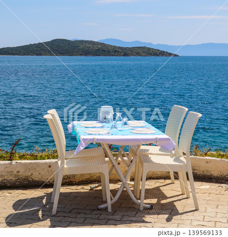 Outdoor restaurant table offering dining with a beautiful sea view in Bitez, Bodrum, Turkey 139569133