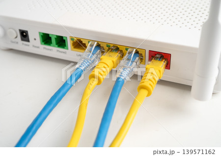 Ethernet cable with wireless router connect to internet service provider internet network. Ethernet cable with wireless router connect to internet service provider internet network. 139571162