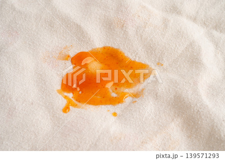Dirty tomato sauce stain or ketchup on cloth. Dirty tomato sauce stain or ketchup on cloth. 139571293