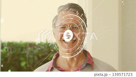 Smiling mature man wearing glasses, beige sweater over pink shirt, standing at porch showing HUD Smiling mature man wearing glasses, beige sweater over pink shirt, standing at porch showing HUD 139571723