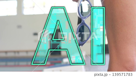Standing mature swimmer in swimsuit holding goggles at poolside, showing turquoise AI, copy space 139571783