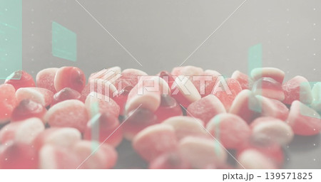 Displaying pile of sugar-coated gummy candies showing sugar crystals on table in studio, mint flare Displaying pile of sugar-coated gummy candies showing sugar crystals on table in studio, mint flare 139571825