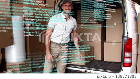 Standing mover smiling at van rear, wearing polo and khaki, with boxes, bubble wrap, code overlay Standing mover smiling at van rear, wearing polo and khaki, with boxes, bubble wrap, code overlay 139571885