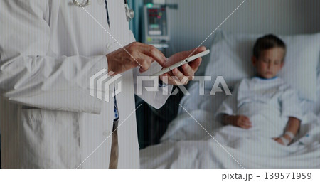 Standing Asian doc in lab coat tapping tablet, monitoring child in hospital bed, copy space Standing Asian doc in lab coat tapping tablet, monitoring child in hospital bed, copy space 139571959