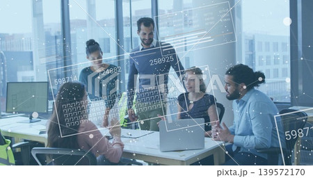 Leading manager wearing sweater leaning forward presenting data HUD at office meeting with laptops Leading manager wearing sweater leaning forward presenting data HUD at office meeting with laptops 139572170