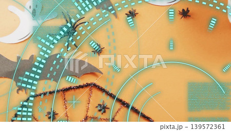 Showing center cluster pulsing with cyan overlays on studio flatlay, spiders bat moon tinsel orange Showing center cluster pulsing with cyan overlays on studio flatlay, spiders bat moon tinsel orange 139572361