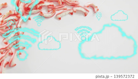 Showing red-pink ribbons left of white studio tabletop, with cyan cloud wifi pin icons, copy space Showing red-pink ribbons left of white studio tabletop, with cyan cloud wifi pin icons, copy space 139572372