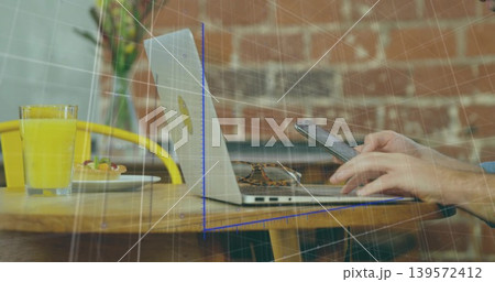 Holding phone, man with blue sleeve tapping screen at cafe table, open laptop and sunglasses Holding phone, man with blue sleeve tapping screen at cafe table, open laptop and sunglasses 139572412