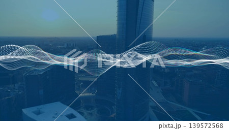 Highlighting reflective cylindrical skyscraper rising over downtown plaza, showing waveform overlay Highlighting reflective cylindrical skyscraper rising over downtown plaza, showing waveform overlay 139572568