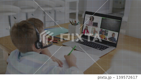 Writing child wearing headset, light top sitting at study corner, with laptop and green pencil Writing child wearing headset, light top sitting at study corner, with laptop and green pencil 139572617