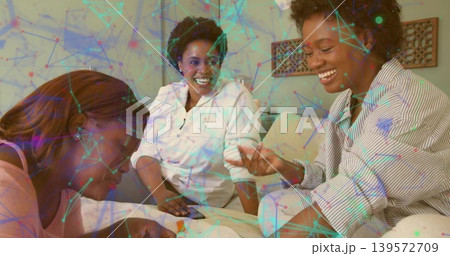 Talking three women in button, white, pink tops sitting at home with phone, papers, network overlay Talking three women in button, white, pink tops sitting at home with phone, papers, network overlay 139572709