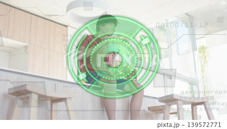 Sitting Asian man wearing red tee and shorts on wooden counter, HUD overlay showing timecode Sitting Asian man wearing red tee and shorts on wooden counter, HUD overlay showing timecode 139572771