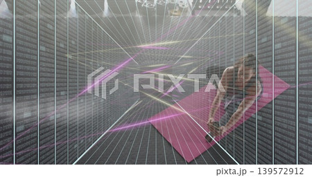 Bending woman in sportswear reaching for weight on pink mat amid server racks neon-grid, copy space 139572912