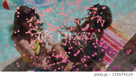 Sitting three women drinking at pool edge wearing swimsuits denim shorts beach ball pink overlay Sitting three women drinking at pool edge wearing swimsuits denim shorts beach ball pink overlay 139574129