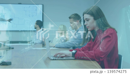 Typing woman in red blouse working on laptop at wooden conference table, screen overlay, copy space Typing woman in red blouse working on laptop at wooden conference table, screen overlay, copy space 139574275