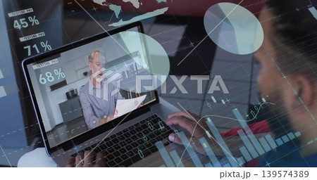 Watching laptop screen presenter wearing shirt speaking in kitchen, holding printed papers, charts Watching laptop screen presenter wearing shirt speaking in kitchen, holding printed papers, charts 139574389