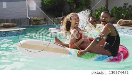 Laughing pair in red bikini, black swimsuit floating on inflatable rings in yard pool, HUD visible Laughing pair in red bikini, black swimsuit floating on inflatable rings in yard pool, HUD visible 139574481